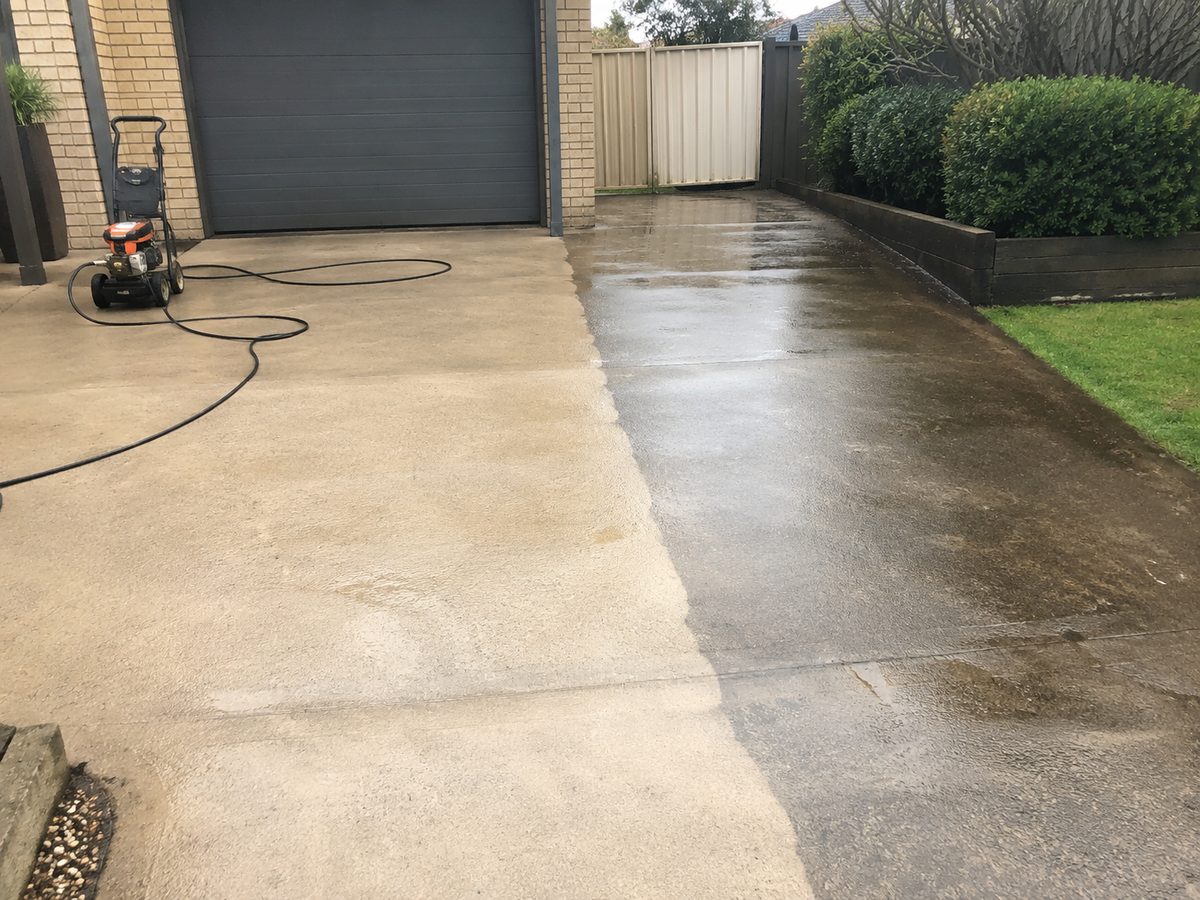Driveway part-way through pressure cleaning