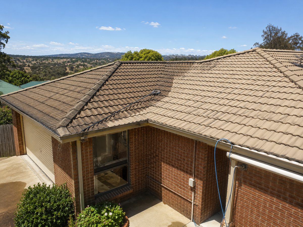 Tiled roof being cleaned