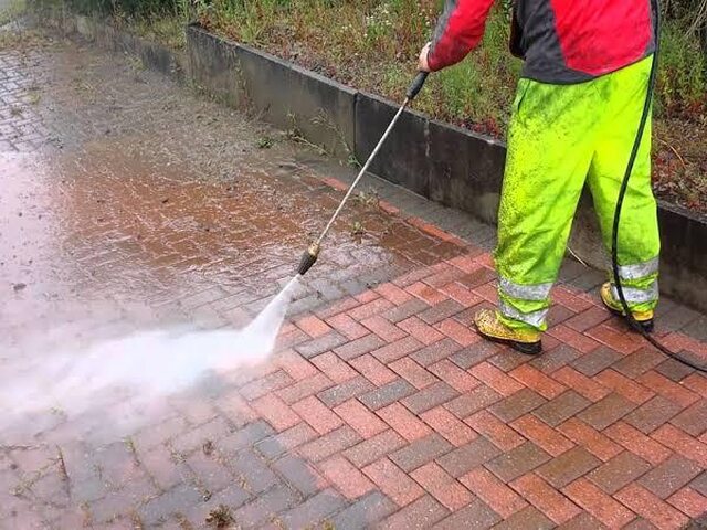 Pressure cleaning brick paving